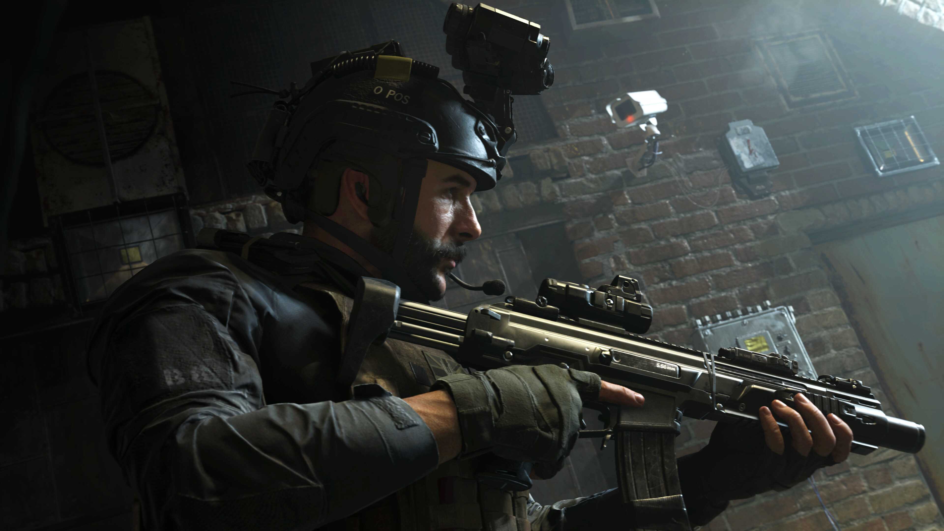 Screenshot from Call of Duty: Modern Warfare (2019) video game of armed soldier in dark alleyway