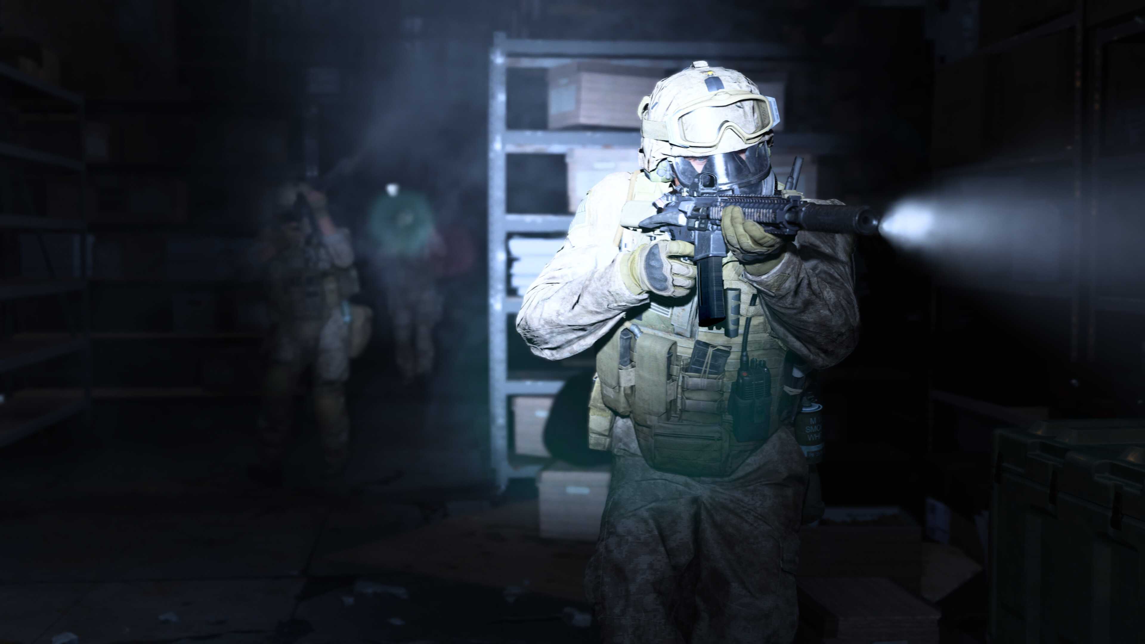 Screenshot from Call of Duty: Modern Warfare (2019) video game of armed soldiers walking through a dark room with flashlights