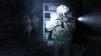 Screenshot from Call of Duty: Modern Warfare (2019) video game of armed soldiers walking through a dark room with flashlights