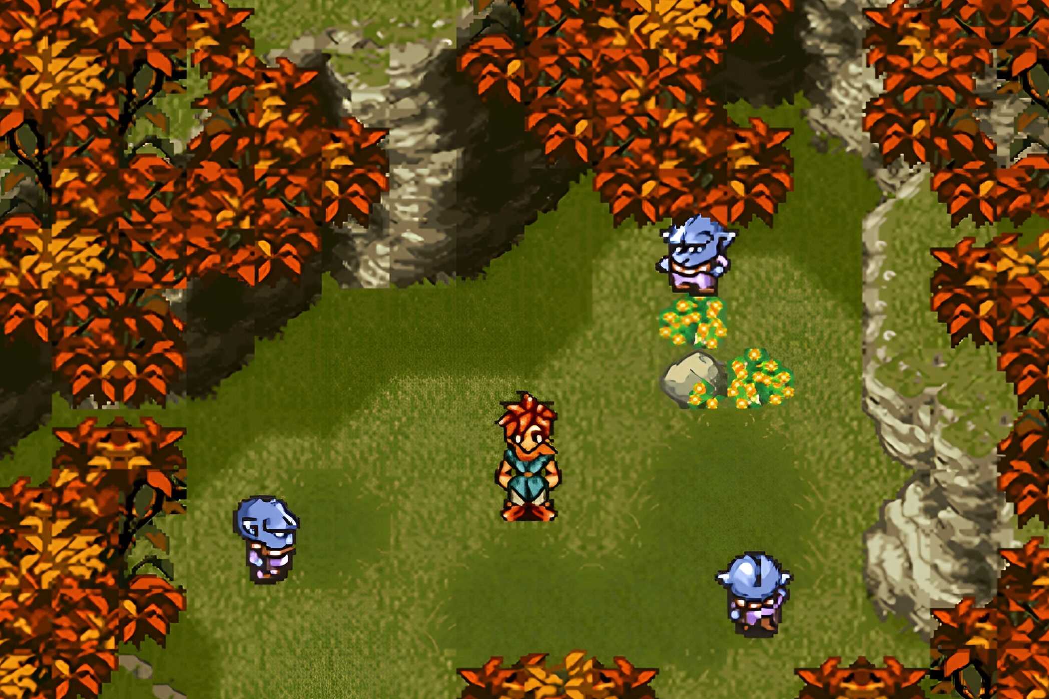 A screenshot from the game Chrono Trigger, showing 2D characters in a green field with red flora. The red-haired protagonist stands in the center, surrounded by blue foes.