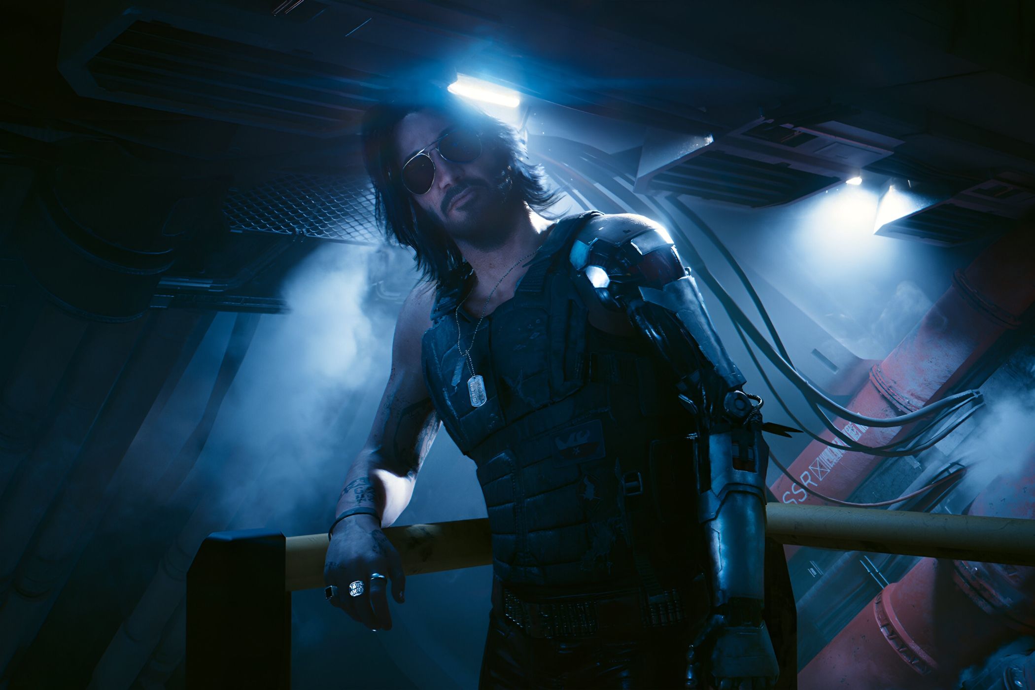 A screenshot from Cyberpunk 2077: Phantom Liberty, showing Johnny Silverhand, played by Keanu Reeves, leaning against a railing as he looks at the protagonist.