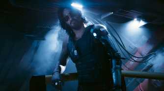 A screenshot from Cyberpunk 2077: Phantom Liberty, showing Johnny Silverhand, played by Keanu Reeves, leaning against a railing as he looks at the protagonist.