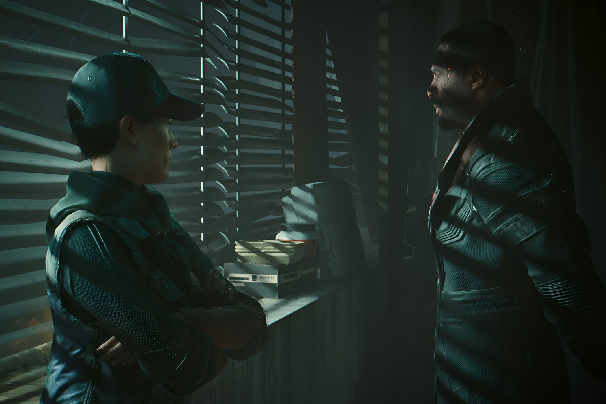 A screenshot from Cyberpunk 2077: Phantom Liberty, showing two characters shrouded in darkness as they stand next to a window.