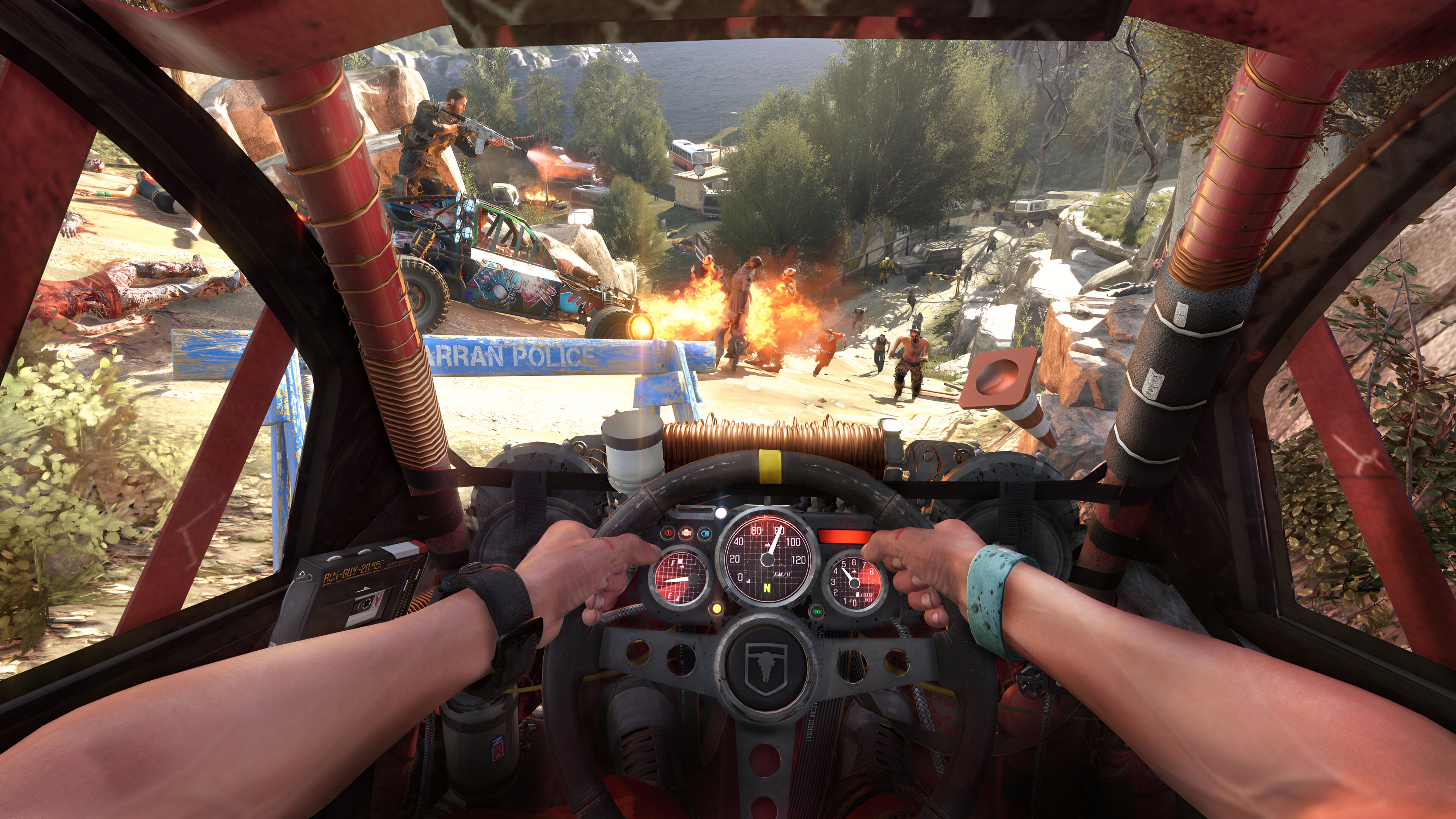 A screenshot from Dying Light: The Following, showing a first-person view of driving a buggy while another character in a different buggy shoots zombies.