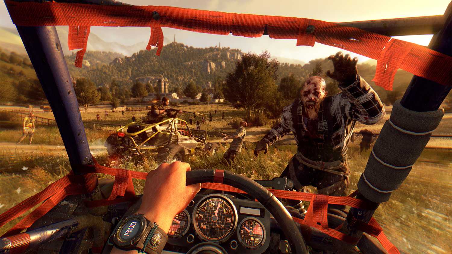 A screenshot from Dying Light: The Following, showing a first-person view of driving a dune buggy in the countryside as a zombie charges towards it.
