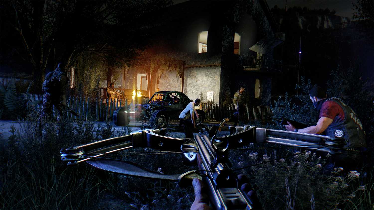 A screenshot from Dying Light: The Following, showing a character holding a crossbow in the night as other characters sneak up on a compound.