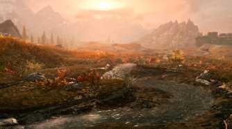 A screenshot from the game The Elder Scrolls V: Skyrim, showing a beautiful sunset as small stream of water runs through a lush field bathed in the light of the setting sun.