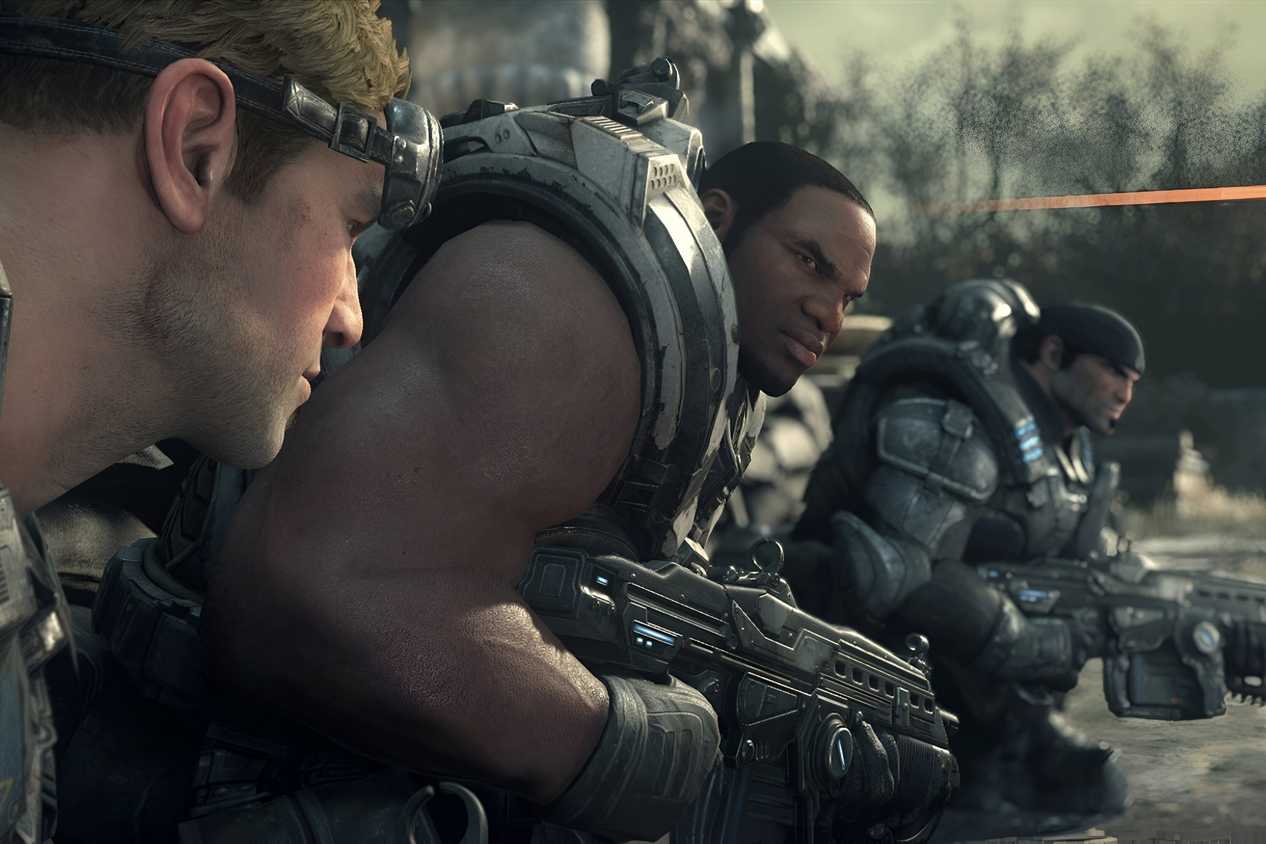 A screenshot from the game Gears of War: Ultimate Edition, showing three men wearing armor and weilding weapons.