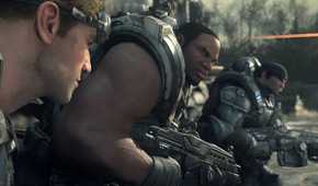 A screenshot from the game Gears of War: Ultimate Edition, showing three men wearing armor and weilding weapons.