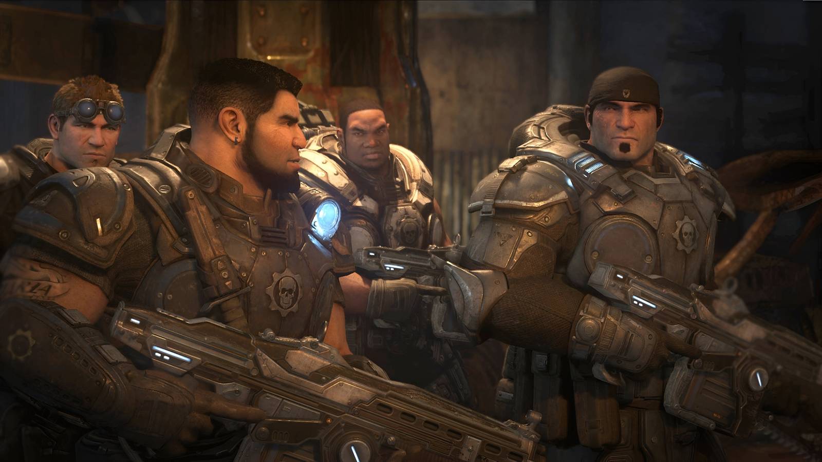 A screenshot from the game Gears of War: Ultimate Edition, showing four men in a squad wearing big, bulky armor and wielding weapons, looking at each other.