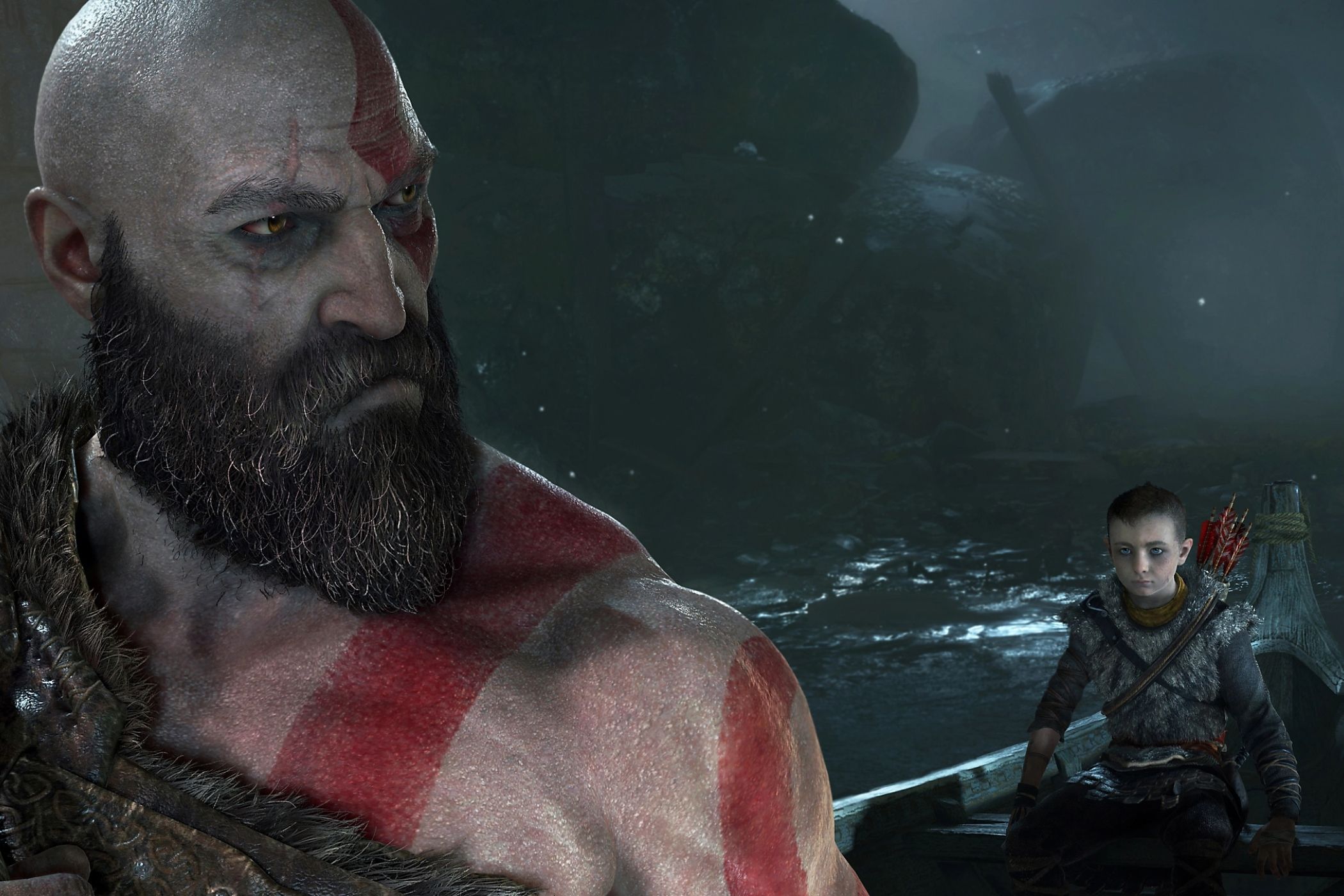 Kratos, a Greek god with white skin and red tattoos, looking over his shoulder at his young child.