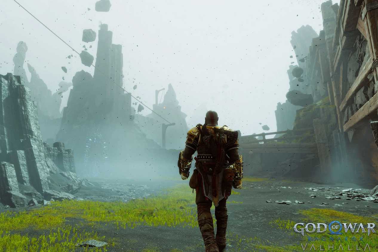A screenshot from God of War Ragnarok: Valhalla, showing a isty environment as Kratos, the protagonist, walks through it.