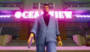 Screenshot from Grand Theft Auto Trilogy: The Definitive Edition video game of Grand Theft Auto: Vice City character walking with a pistol, with a bright neon sign behind them