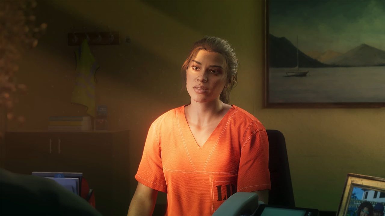 Image from Grand Theft Auto VI video game of female character in prison jumpsuit sitting in an office.