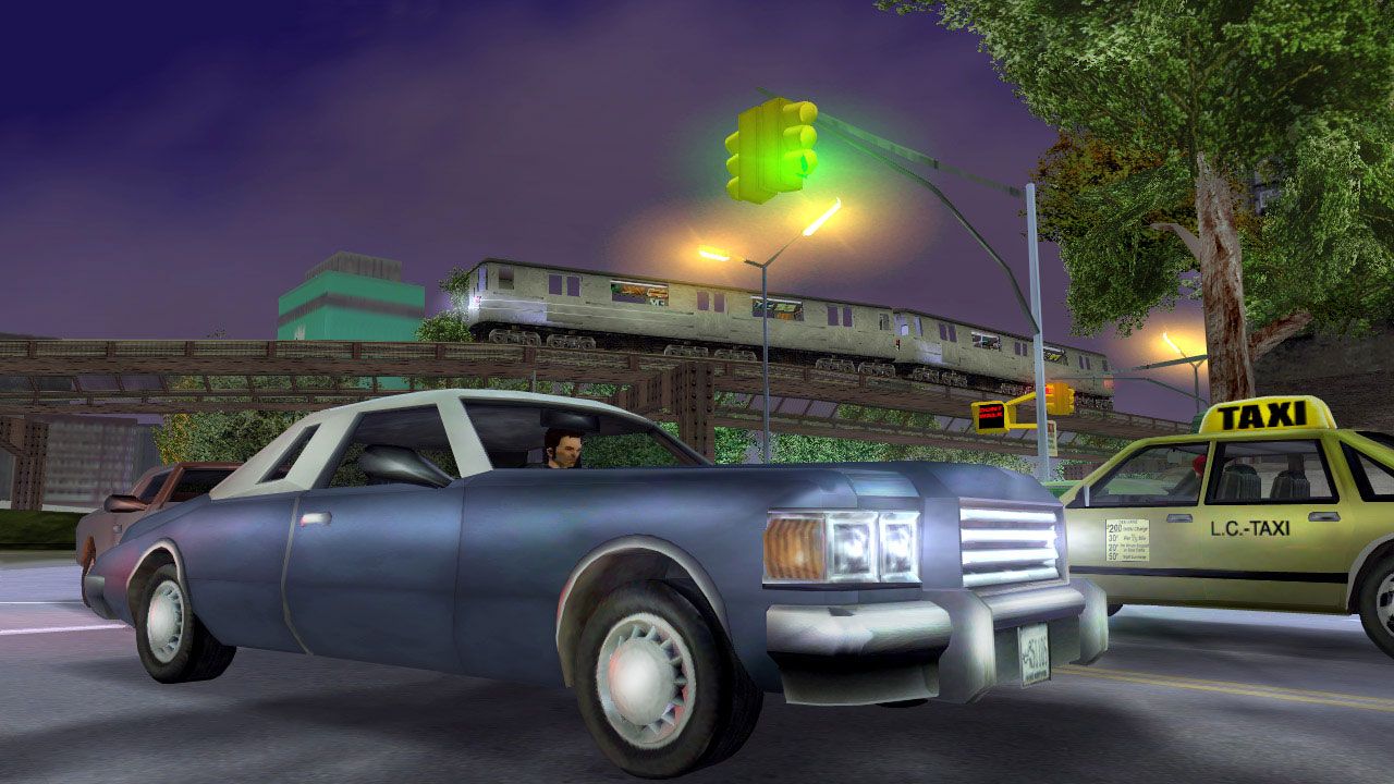 Claude driving a pale dark blue car with a white roof in the streets of Liberty City