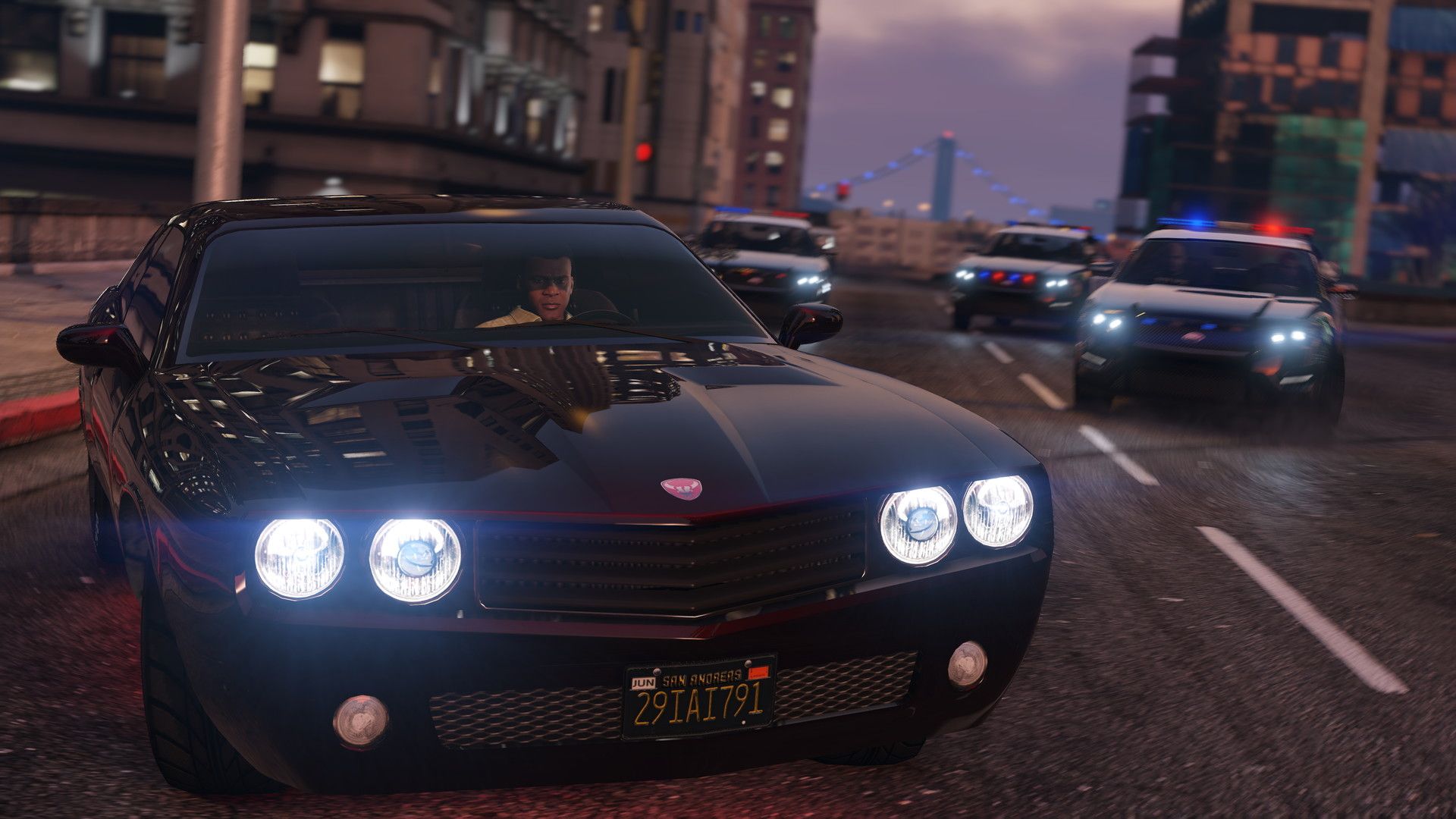 Three police cars chasing Franklin driving a black muscle car
