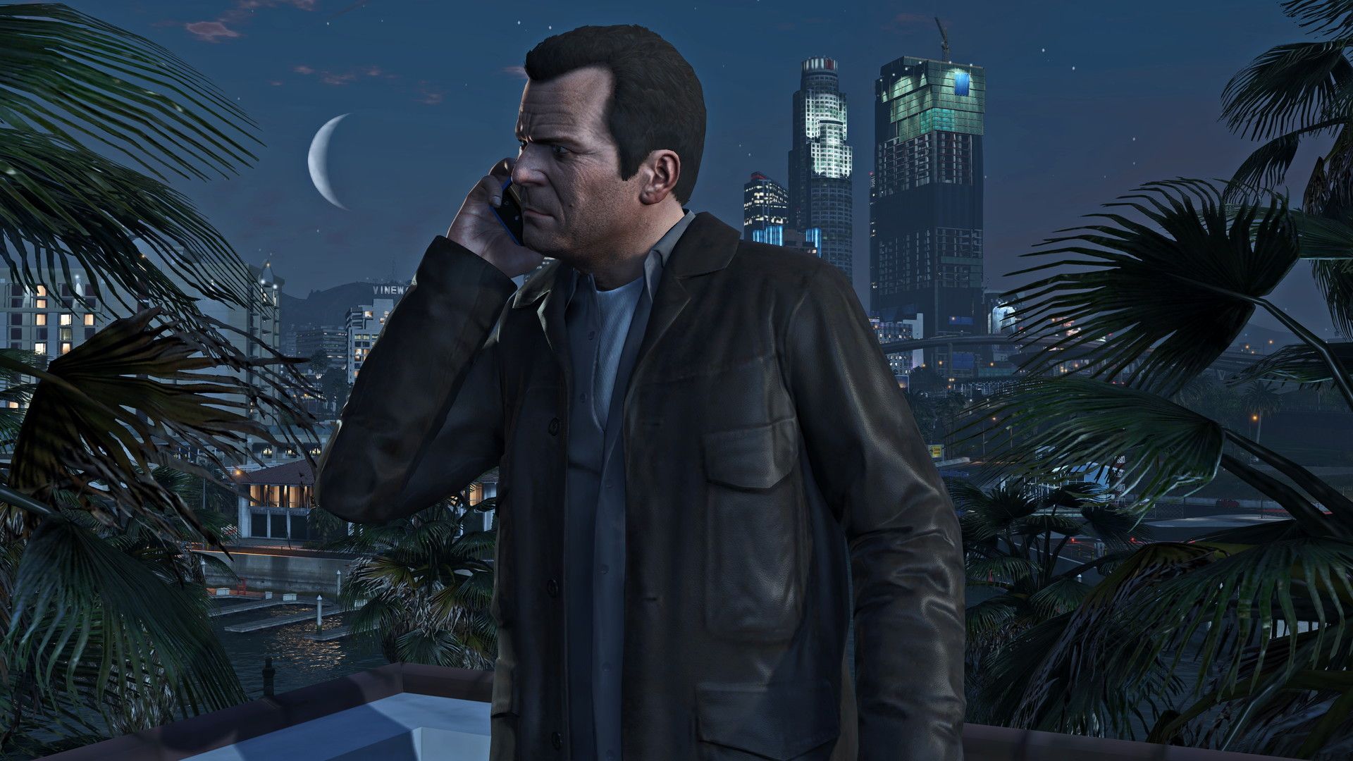 Michael taking a phone call with the backdrop of Los Santos' cityscape
