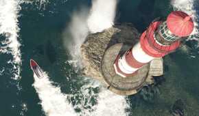 Top-down view of a lighthouse and a speed boat