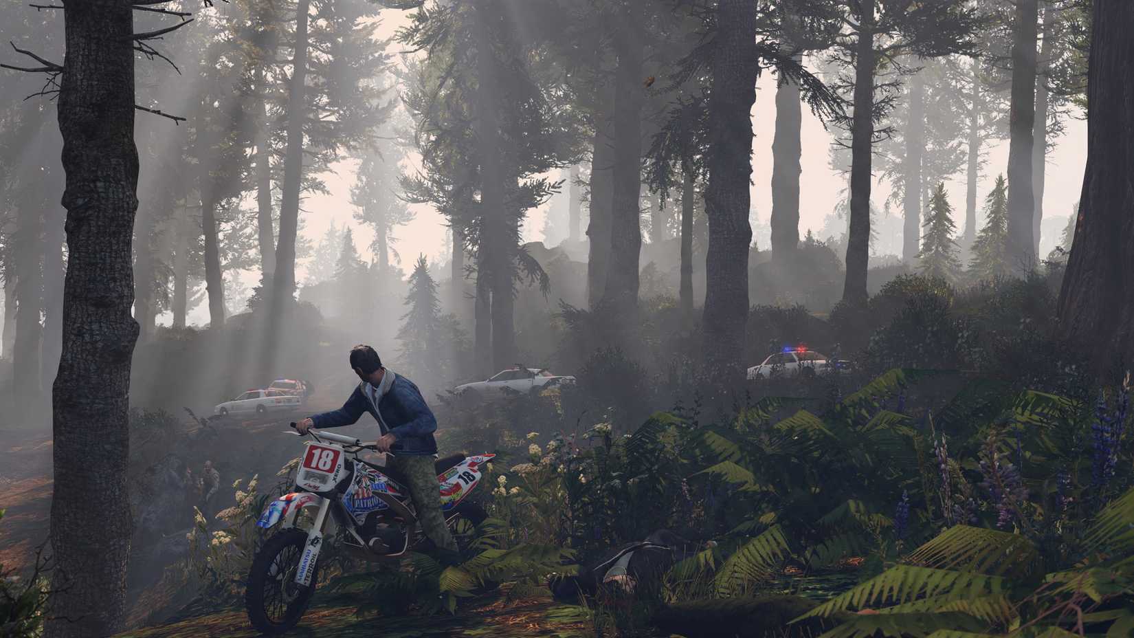 Trevor riding a dirt bike in a forest