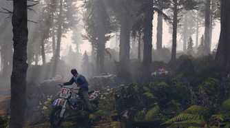 Trevor riding a dirt bike in a forest