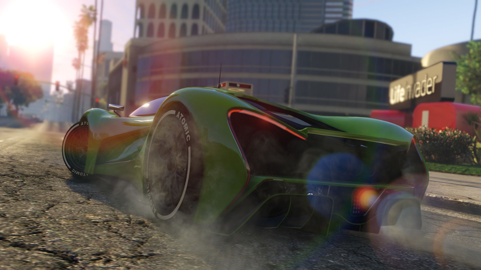 Rear view of a green sports car revving the engine in front of the Life Invader HQ