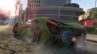 Rear view of a green sports car revving the engine in front of the Life Invader HQ