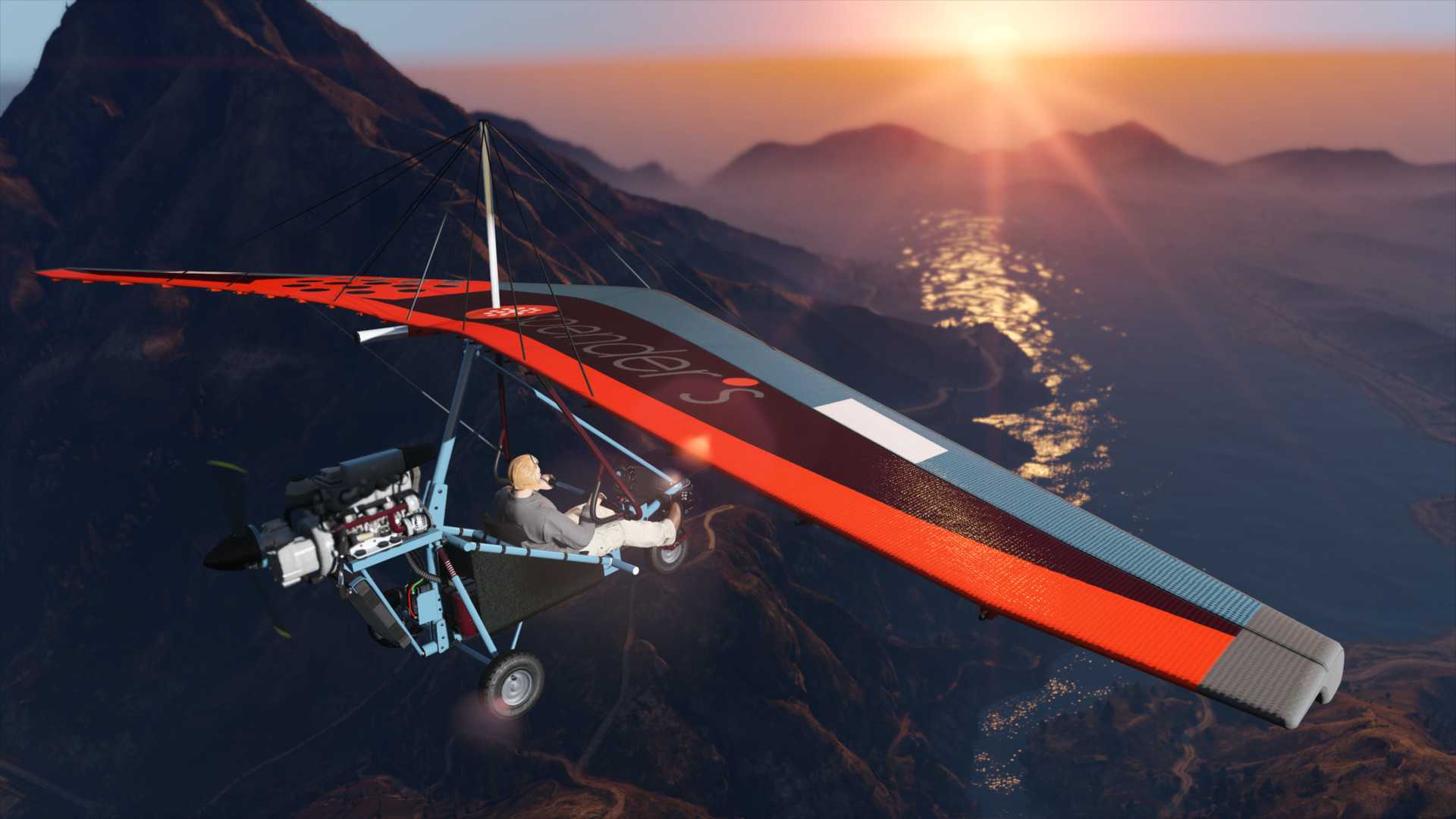 Player flying a para trike above Mount Chiliad and heading to Sandy Shores