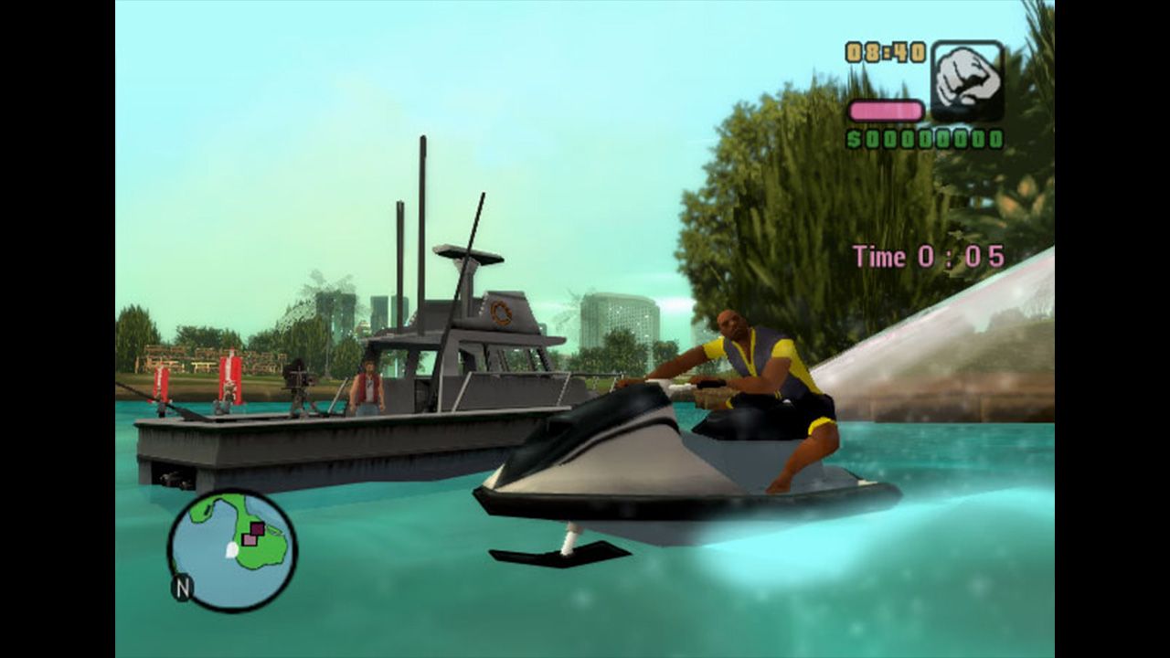 Vic riding a jet ski with a fishing boat in the background