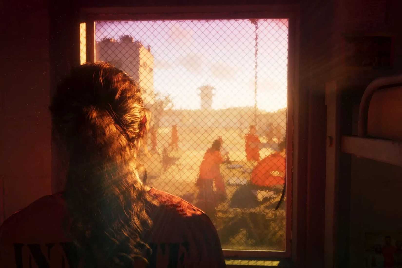 GTA VI Lucía mirando por la ventana de la prisión