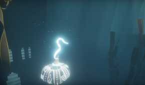 A screenshot from the game Journey, showing the protagonist's robes glow as they float through a dark, blue, environment.