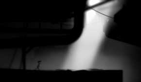 A screenshot from the game Limbo showing sunlight breaking into the dark, eerie, black-and-white environment as the protagonist runs towards it.
