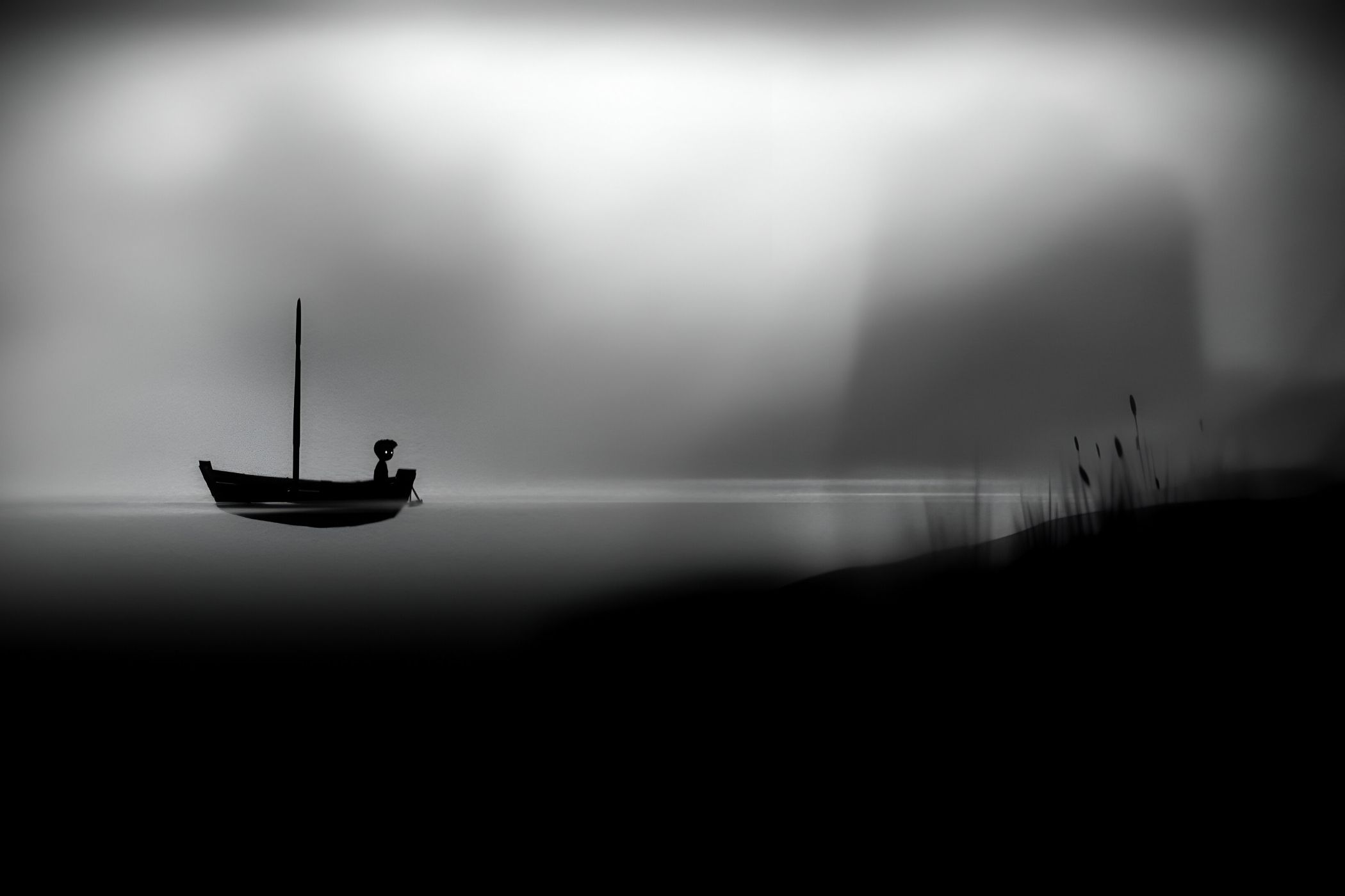 A screenshot from the game Limbo, where the silhouetted protagonist travels in a boat on water.