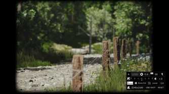 Screenshot from Lushfoil Photography Sim video game of camera taking a photo of wooden fence with metal wire
