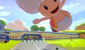Mario Kart 8 players driving under giant toad balloon