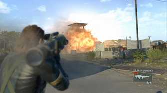 Metal Gear Solid V: Ground Zeroes screeshot, Snake shoots a rocket launcher at a now exploding tower