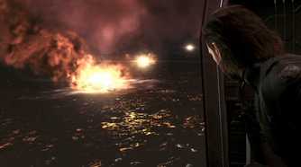 MGSV Ground Zeroes screenshot, Snake looks out of the helicopter at the destruction of Mother Base