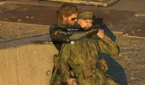 MGSV Ground Zeroes screenshot, Snake holds someone hostage as a UI is overlaid saying "Spit it out" and "Call 'em"