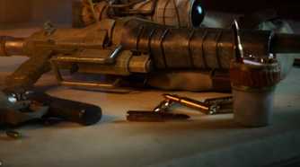 Concord gun on table with bullets