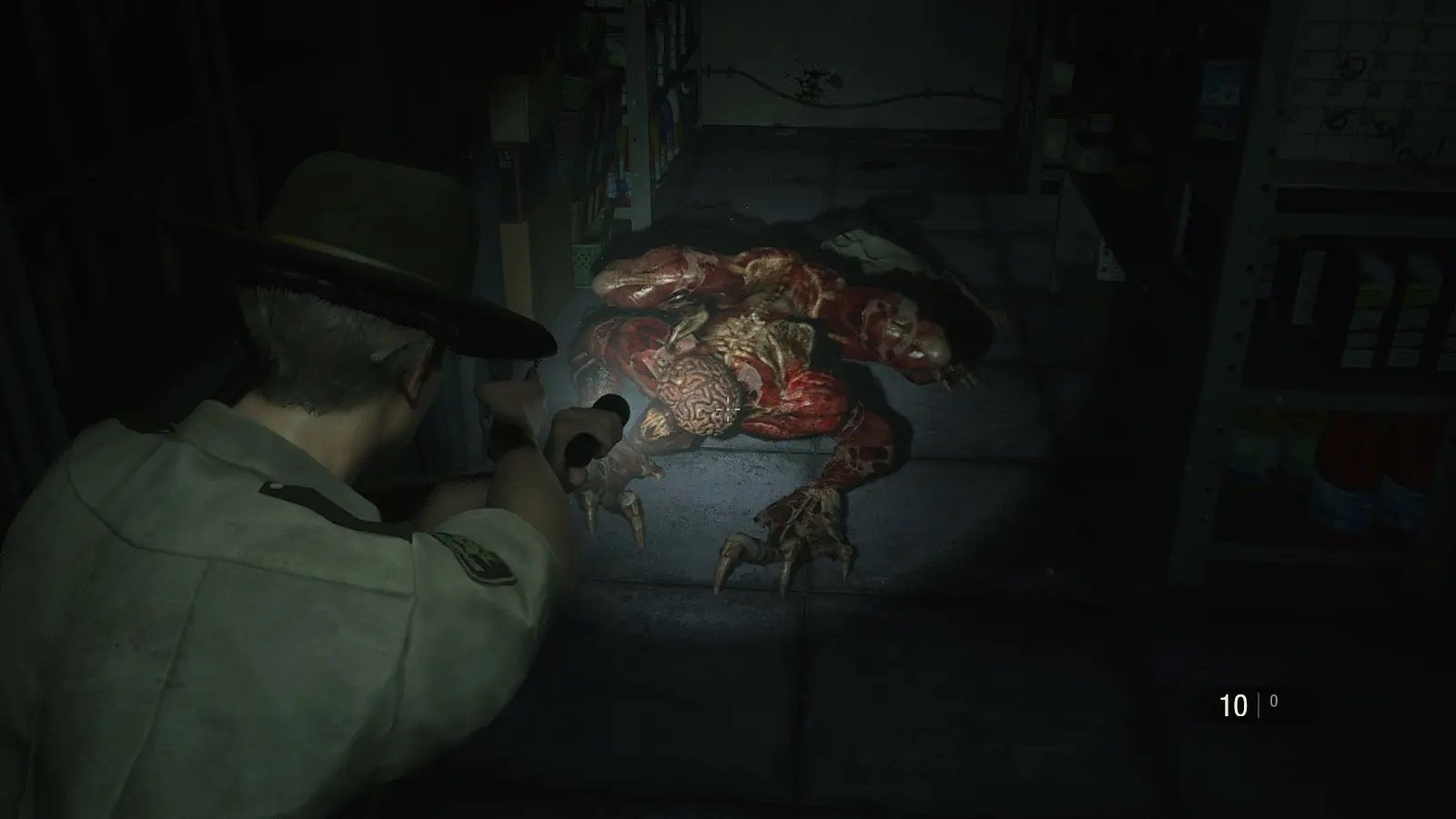 Screenshot of Resident Evil 2 video game with V-Act Nightmare mod installed of player character shining flashlight on Licker zombie.
