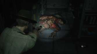 Screenshot of Resident Evil 2 video game with V-Act Nightmare mod installed of player character shining flashlight on Licker zombie.