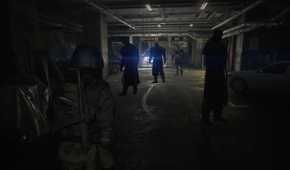 Screenshot of Resident Evil 2 video game with X-Treme Nightmare mod installed of four Mr. X characters in garage.
