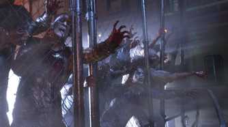 Screenshot from Resident Evil 3 Remake of zombies clamoring against a fence