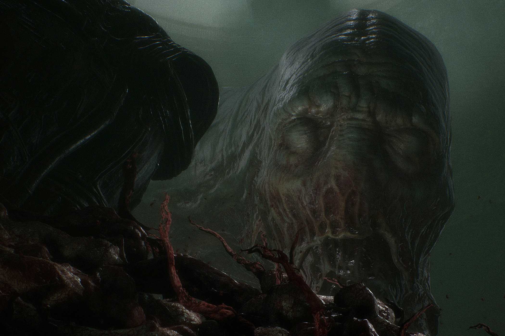 A screenshot from the game Scorn, showing a grotesque, huge biomechanical face looming in the darkness with its eyes closed.