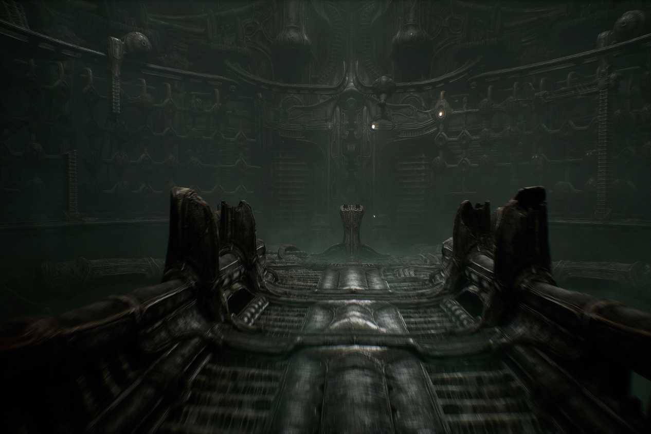 a screenshot from the game Scorn, showing a dark, metallic environment and walkway, with an altar at the end of it.