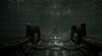 a screenshot from the game Scorn, showing a dark, metallic environment and walkway, with an altar at the end of it.