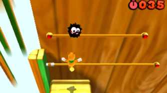 Screenshot of Tanooki Mario and a Fuzzy from Super Mario Bros. 3D Land
