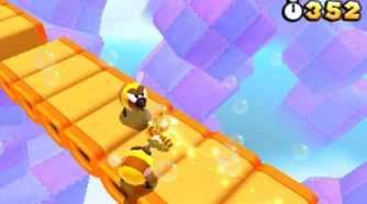 Screenshot of Tanooki Mario and some bees from Super Mario Bros. 3D Land