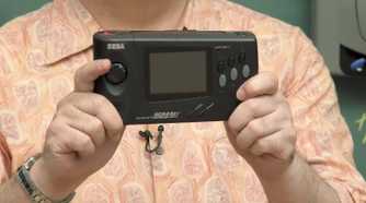 Person holding the Sega Nomad handheld