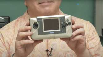 Person holding the Sega Venus prototype handheld