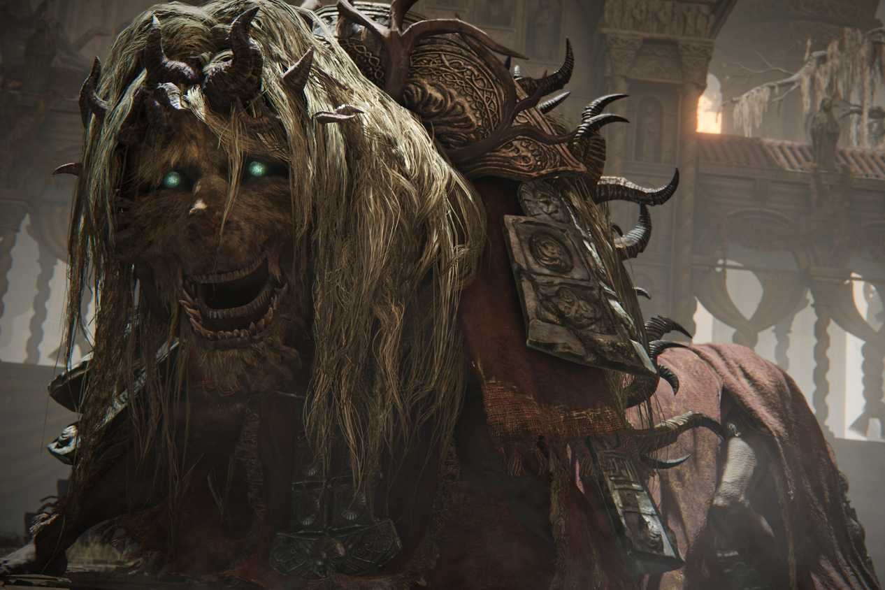 An image from the game Elden Ring: Shadow of the Erdtree, showing a strange creature with flowing white hair and glowing green eyes.